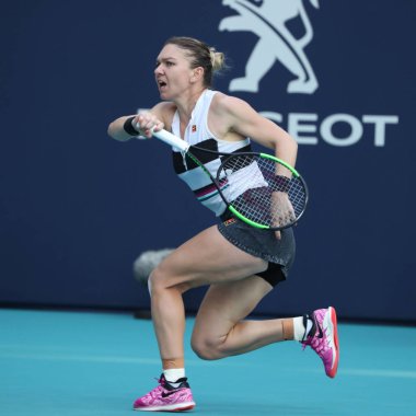 MIAMI GARDENS, FLORIDA - MARCH 27, 2019: Grand Slam Champion Simona Halep of Romania in action during her quarter-final match at 2019 Miami Open at the Hard Rock Stadium in Miami Gardens, Florida