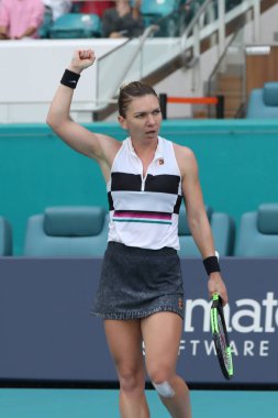 MIAMI GARDENS, FLORIDA - MARCH 27, 2019: Grand Slam Champion Simona Halep of Romania in action during her quarter-final match at 2019 Miami Open at the Hard Rock Stadium in Miami Gardens, Florida