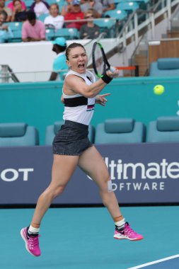 MIAMI GARDENS, FLORIDA - MARCH 27, 2019: Grand Slam Champion Simona Halep of Romania in action during her quarter-final match at 2019 Miami Open at the Hard Rock Stadium in Miami Gardens, Florida
