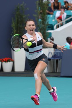 MIAMI GARDENS, FLORIDA - MARCH 27, 2019: Grand Slam Champion Simona Halep of Romania in action during her quarter-final match at 2019 Miami Open at the Hard Rock Stadium in Miami Gardens, Florida