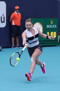 MIAMI GARDENS, FLORIDA - MARCH 27, 2019: Grand Slam Champion Simona Halep of Romania in action during her quarter-final match at 2019 Miami Open at the Hard Rock Stadium in Miami Gardens, Florida