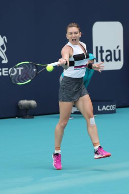 MIAMI GARDENS, FLORIDA - MARCH 27, 2019: Grand Slam Champion Simona Halep of Romania in action during her quarter-final match at 2019 Miami Open at the Hard Rock Stadium in Miami Gardens, Florida