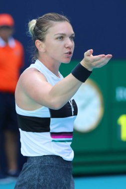 MIAMI GARDENS, FLORIDA - MARCH 27, 2019: Grand Slam Champion Simona Halep of Romania in action during her quarter-final match at 2019 Miami Open at the Hard Rock Stadium in Miami Gardens, Florida