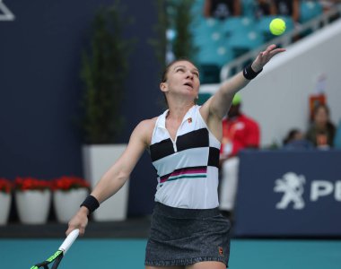 MIAMI GARDENS, FLORIDA - MARCH 27, 2019: Grand Slam Champion Simona Halep of Romania in action during her quarter-final match at 2019 Miami Open at the Hard Rock Stadium in Miami Gardens, Florida