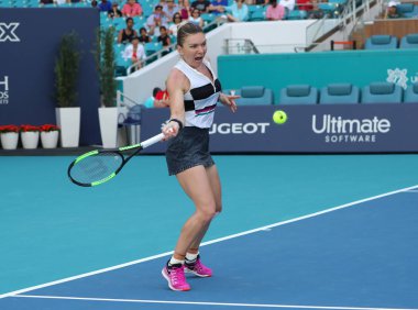 MIAMI GARDENS, FLORIDA - MARCH 27, 2019: Grand Slam Champion Simona Halep of Romania in action during her quarter-final match at 2019 Miami Open at the Hard Rock Stadium in Miami Gardens, Florida