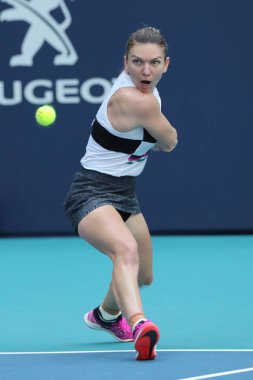 MIAMI GARDENS, FLORIDA - MARCH 27, 2019: Grand Slam Champion Simona Halep of Romania in action during her quarter-final match at 2019 Miami Open at the Hard Rock Stadium in Miami Gardens, Florida
