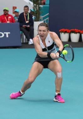 MIAMI GARDENS, FLORIDA - MARCH 27, 2019: Grand Slam Champion Simona Halep of Romania in action during her quarter-final match at 2019 Miami Open at the Hard Rock Stadium in Miami Gardens, Florida