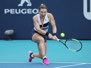 MIAMI GARDENS, FLORIDA - MARCH 27, 2019: Grand Slam Champion Simona Halep of Romania in action during her quarter-final match at 2019 Miami Open at the Hard Rock Stadium in Miami Gardens, Florida