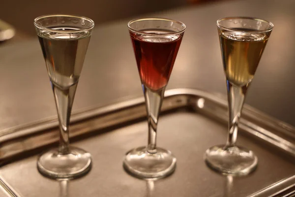 Three shots of Aquavit. Akvavit or aquavit is a distilled spirit that is principally produced in Scandinavia, where it has been produced since the 15th century.
