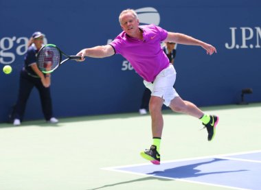 NEW YORK - AUGUST 22, 2018: Former captain of the USA Davis Cup team Patrick McEnroe in action during 2018 US Open exhibition match at newly open Louis Armstrong Stadium at National Tennis Center