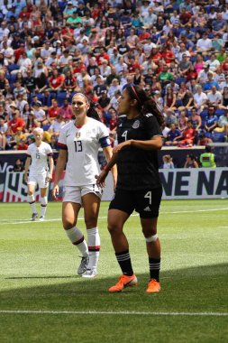 HARRISON, NJ - MAY 26, 2019: U.S. Women's National Soccer Team captain Alex Morgan #13 in action during friendly game against Mexico as preparation for 2019 Women's World Cup on Red Bull Arena  clipart