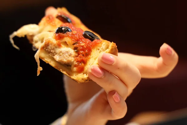Woman eating Chicago Style Deep Dish Cheese Pizza