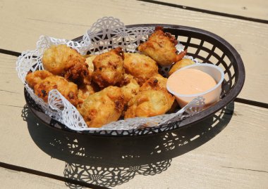 Traditional Bahamian conch fritters clipart