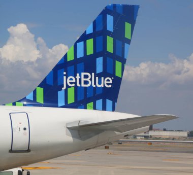 NEW YORK- AUGUST 3, 2019: JetBlue plane tail fin at John F Kennedy International Airport in New York clipart
