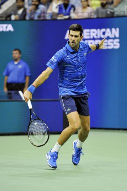 New York - 1 Eylül 2019: Grand Slam Şampiyonu Novak Cokoviç, Billie Jean King Ulusal Tenis Merkezi'nde Stan Wawrinka ile oynanan 2019 ABD Açık 16.