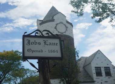 SOUTHAMPTON, NEW YORK - SEPTEMBER 30, 2019: Famous Jobs Lane sign in Southampton,  Long Island. Southampton is an upscale village in The Hamptons on Long Island   clipart