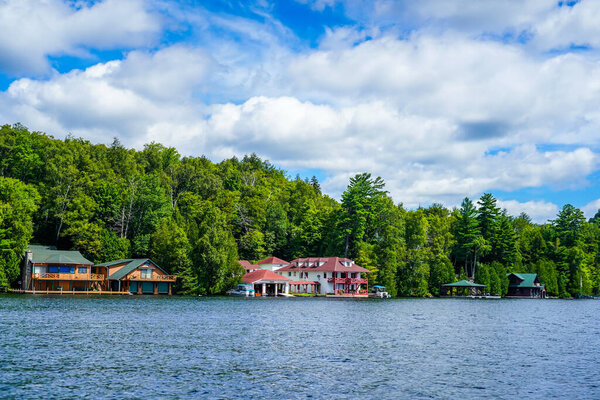 LAKE PLACID, NEW YORK - AUGUST 20, 2020: Luxury boathouse on Lake Placid in New York State's Adirondack Mountains