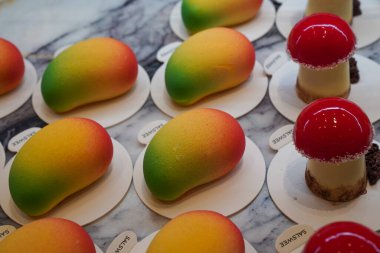 Mango and Mushroom exquisite pastries, crafted lifelike fruit-inspired treats in dessert shop