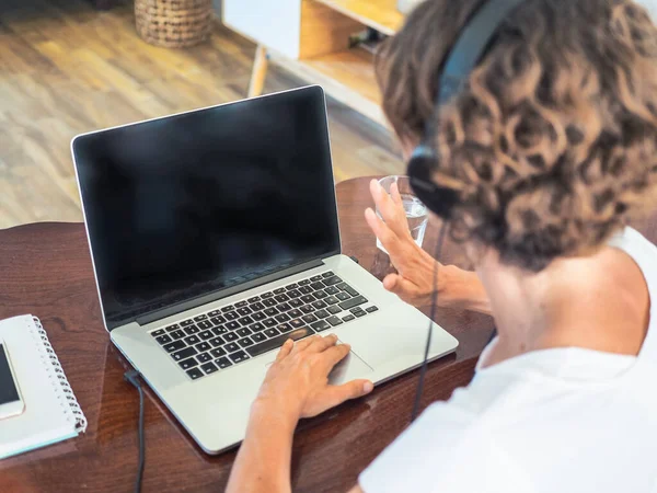 stock image woman with laptop working at home, home office and quarantine concept