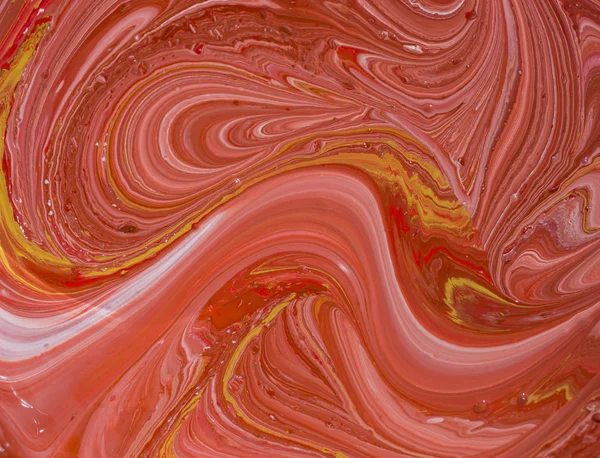 Mixing acrylic paint in different colors. Marbleized.