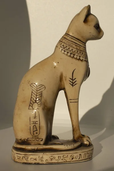 Cats in ancient Egypt. The statuette is a symbol of fertility and the sun.