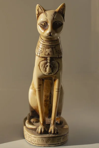 Cats in ancient Egypt. The statuette is a symbol of fertility and the sun.