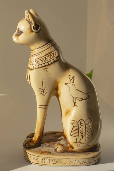 Cats in ancient Egypt. The statuette is a symbol of fertility and the sun.