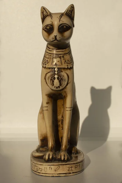 Cats in ancient Egypt. The statuette is a symbol of fertility and the sun.