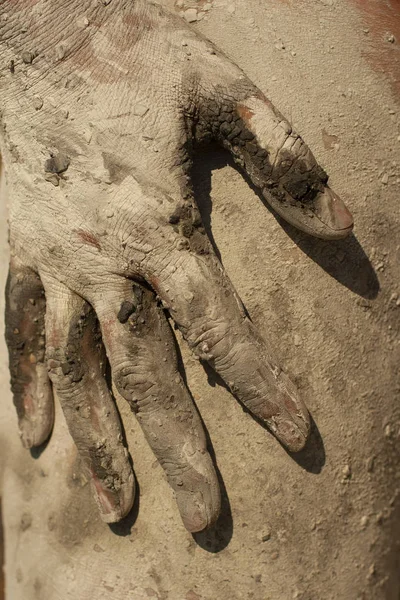 Mud Spa treatments on the Black sea coast. The girl\'s hands on her own body while the healing silicon mud dries.