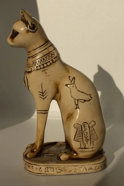 Cats in ancient Egypt. The statuette is a symbol of fertility and the sun.