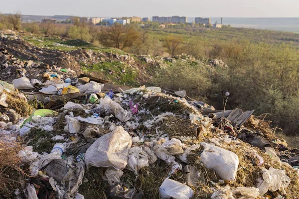 Environmental disaster. Clogging the outskirts of the city. Garbage heaps are an element of the modern European landscape.