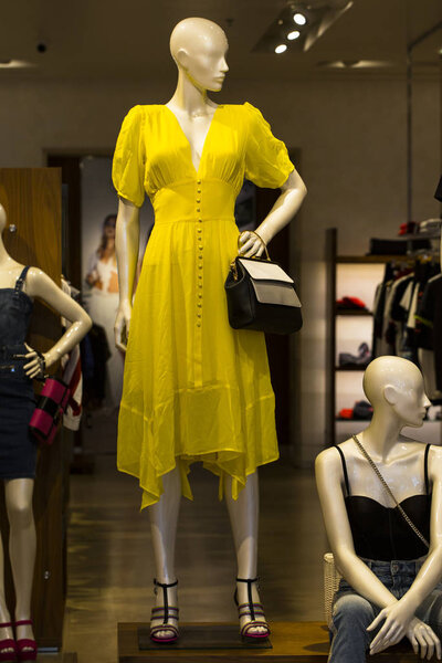 Clothes on mannequins. Design stores, advertising fashion.