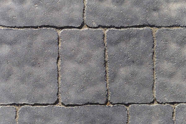 Paving from tiles. Graphic element on a stone. Construction product.