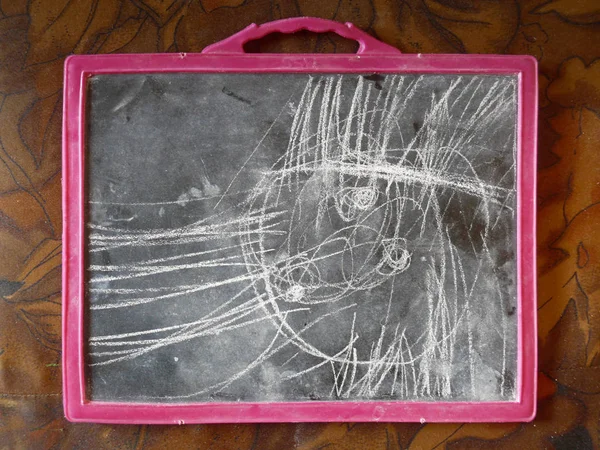 School slate with scribbling