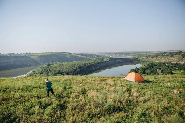 overnight family in a tent in the wild and dawn by the river with a beautiful scenery