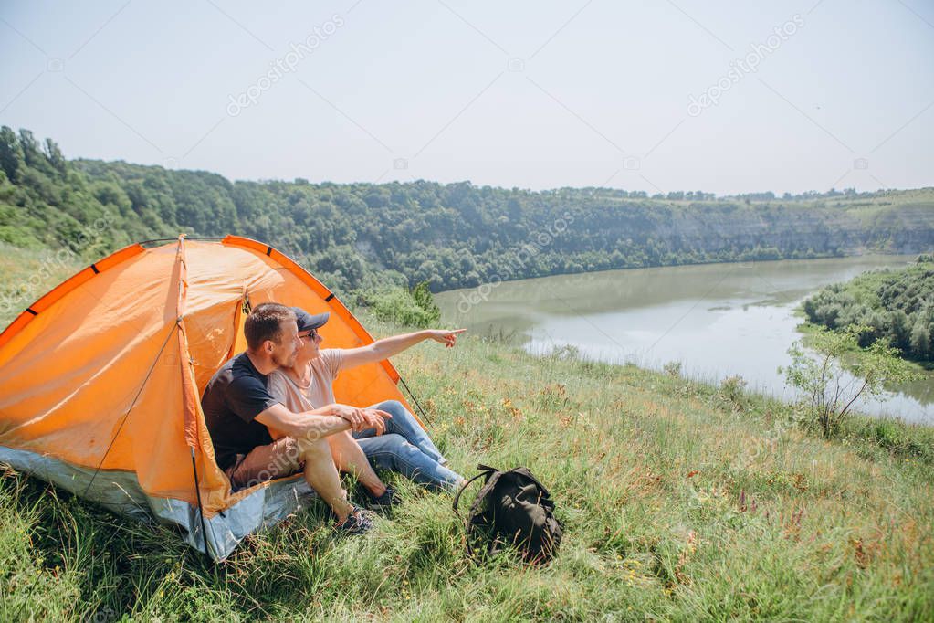 overnight family in a tent in the wild and dawn by the river with a beautiful scenery