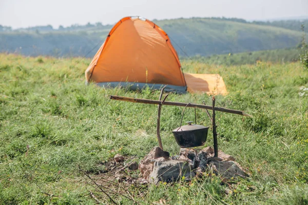 rest and overnight in the wild in a tent near a river with a canyon