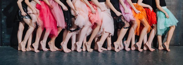 many legs of girlfriends girls stand in a row and pose at a party