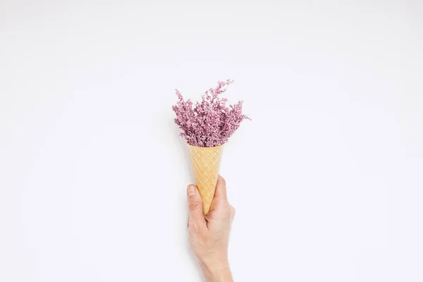 lilac festive flowers in a cup waffle ice cream isolated