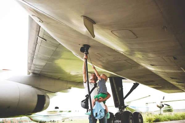 father son retro aviation museum exploring plane