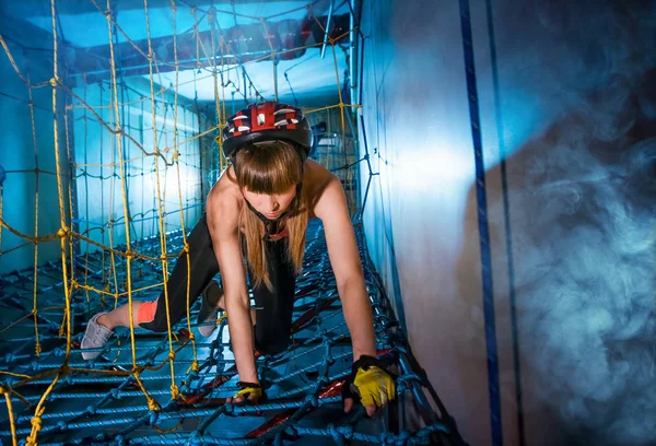 sports entertainment activity inside outfit girl climbs net