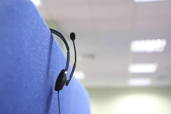 headset headphone microphone inside workplace office blue