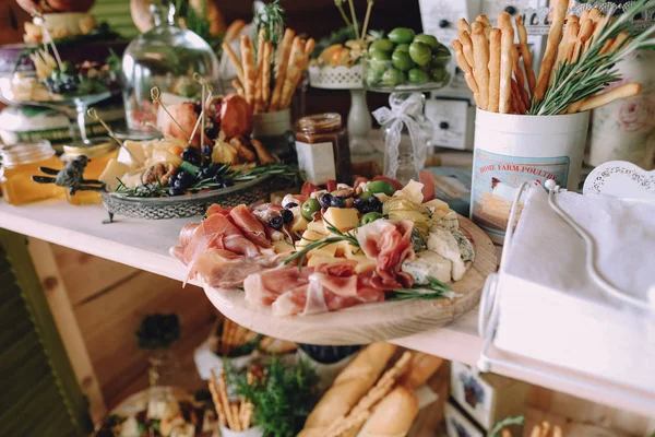 food buffet reception snacks cheese card honey and fruit variety