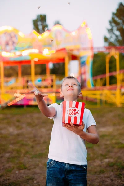 Popcorn child festival fair colorful background blur