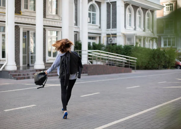 woman business style city street goes bag