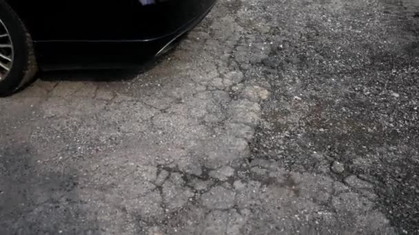 Car Parked Yards Away Large Pothole Crater Parking Lot — Stock Video