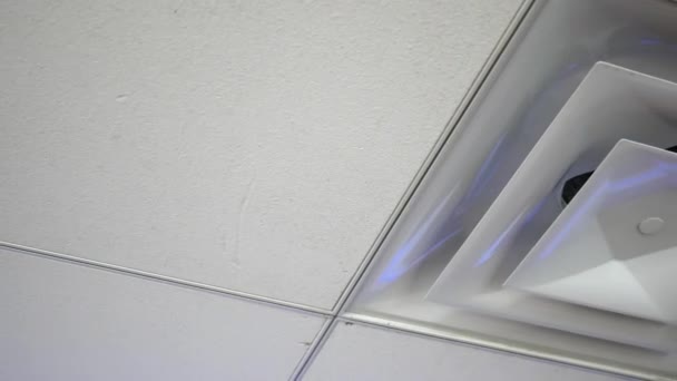 Camera pans to air vent cover on office ceiling — Stock Footage Camera Pans Air Vent Cover Office Ceiling Stock Footage