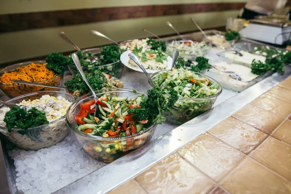 Greek food background. Greek salad, assortment of feta, olives and vegetables. Traditional greek dishes set. 图库照片