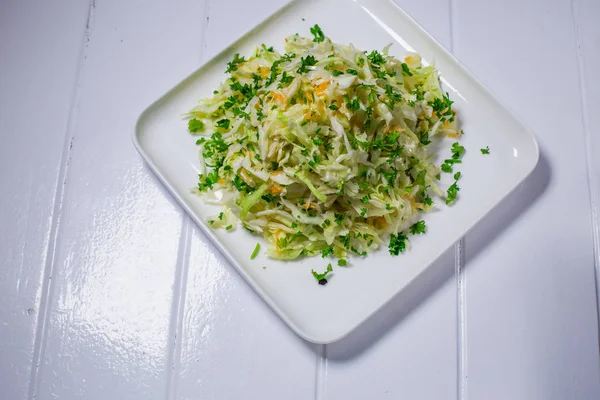 Fresh healthy salad - cabbage, carrot and olive oil — Stock Photo, Image