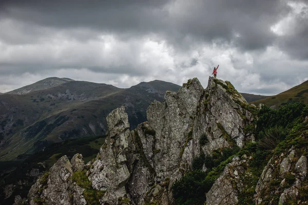 risky traveller climbs the cliff